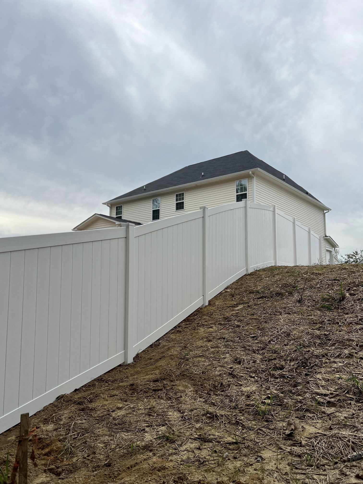 Fayetteville Fence Pros Overcomes Challenging Terrain to Deliver Flawless Vinyl Fence Installation